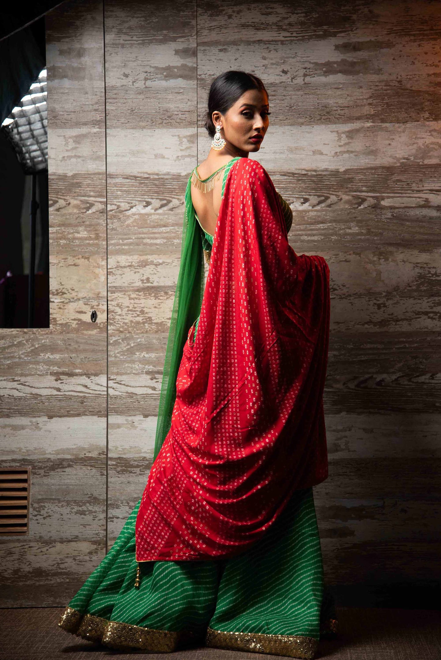 A LA MODE HERITAGE'S EMERALD FLAT LEHENGA WITH BLOUSE LEHERIYA RED & NET DUPATTA