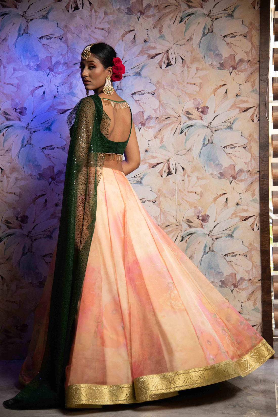 A LA MODE HERITAGE'S CORAL TISSUE LEHENGA WITH EMERALD SEQUENCE BLOUSE